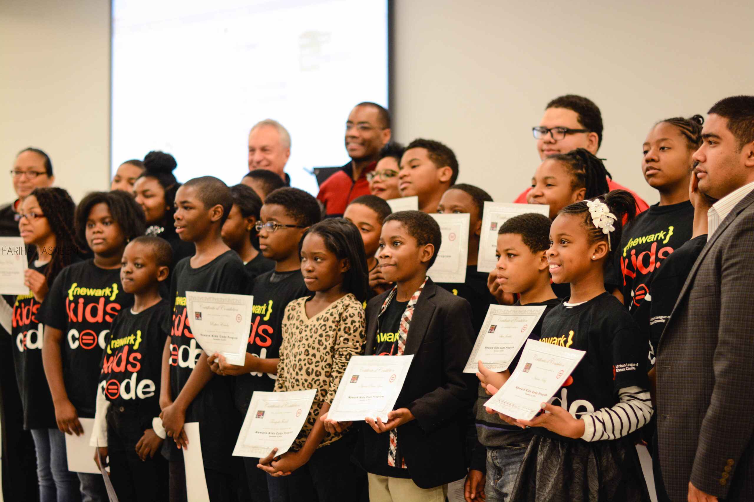 Students receiving completion certificate of the Newark Kids Code Program